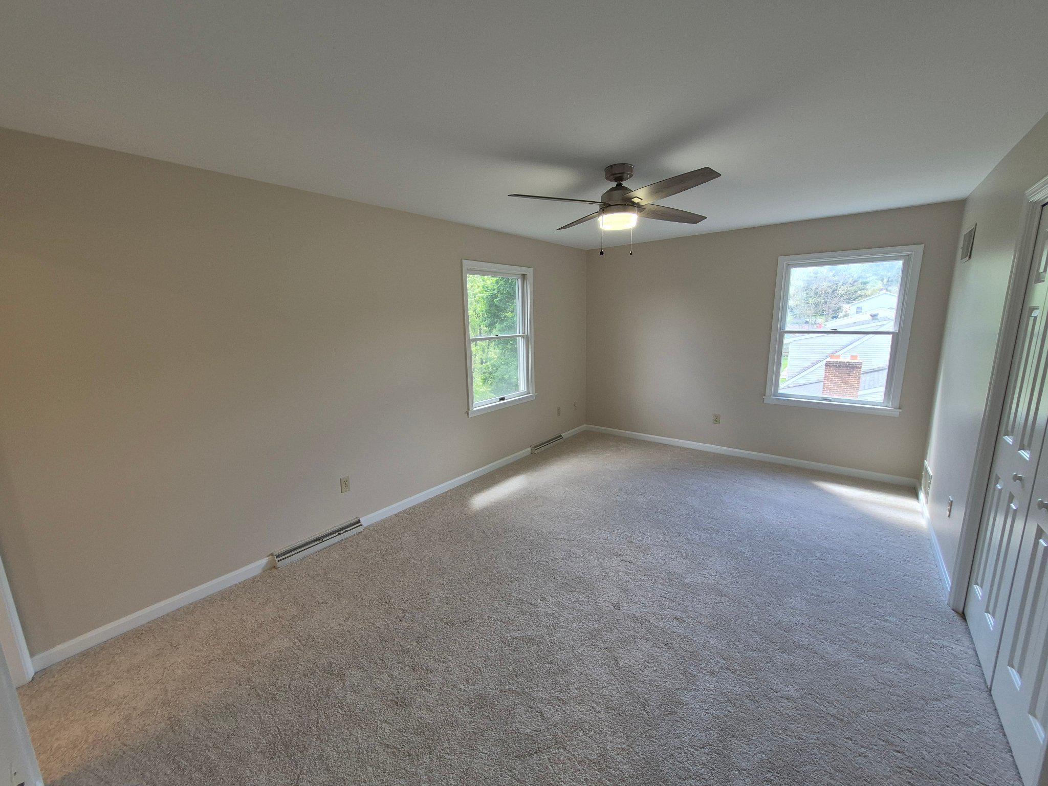 1406 Princeton Road Mechanicsburg, PA 17050 - Photo 35 of 53 an empty room with windows and fan