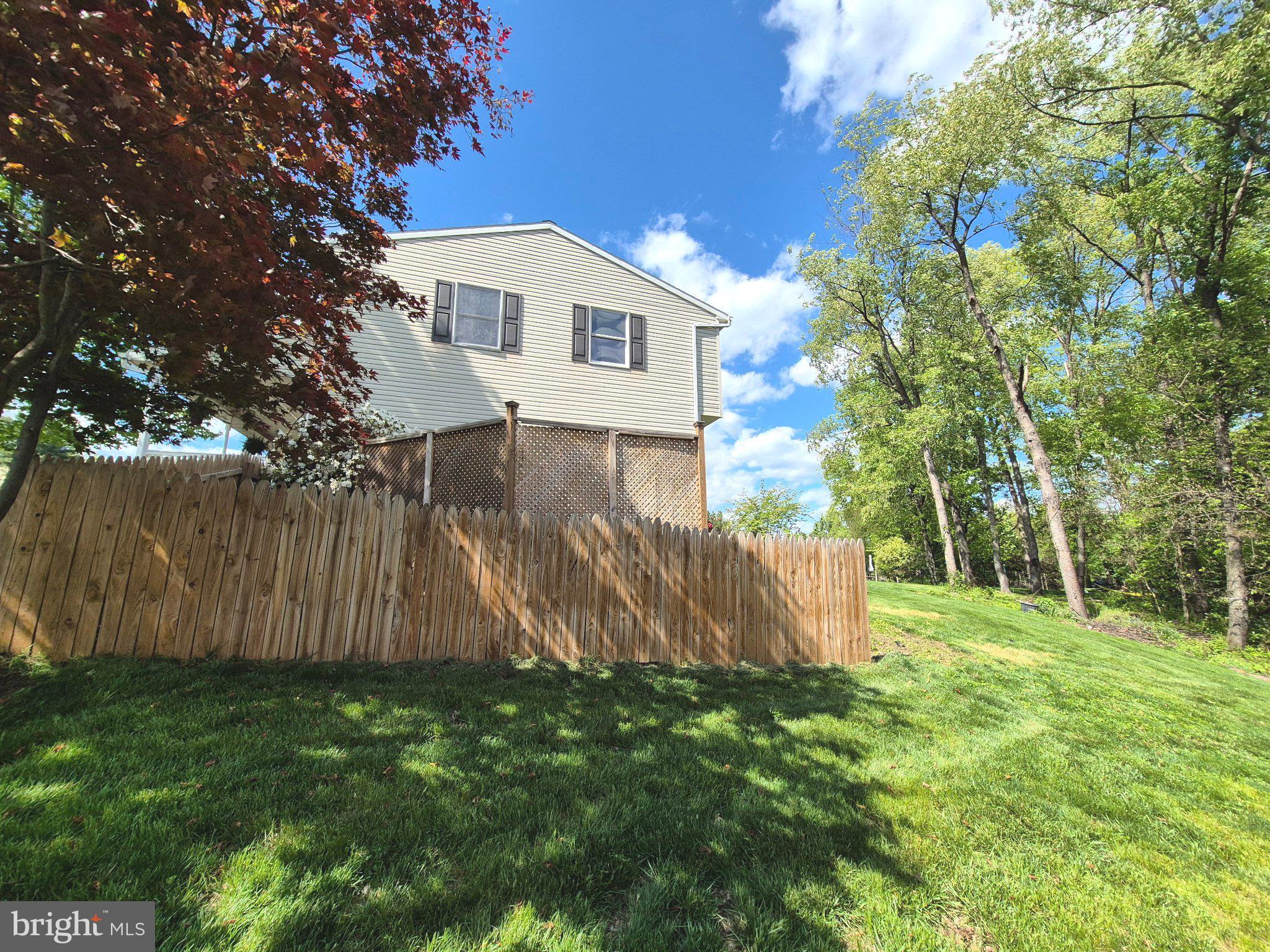 1406 Princeton Road Mechanicsburg, PA 17050 - Photo 44 of 53 a view of a house with a yard