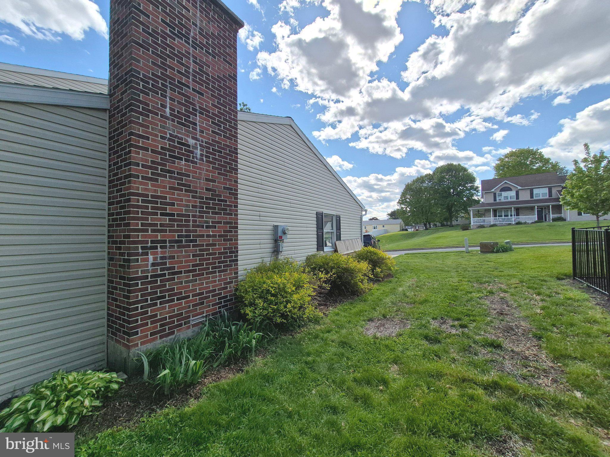 1406 Princeton Road Mechanicsburg, PA 17050 - Photo 46 of 53 a view of a backyard with plants and large tree