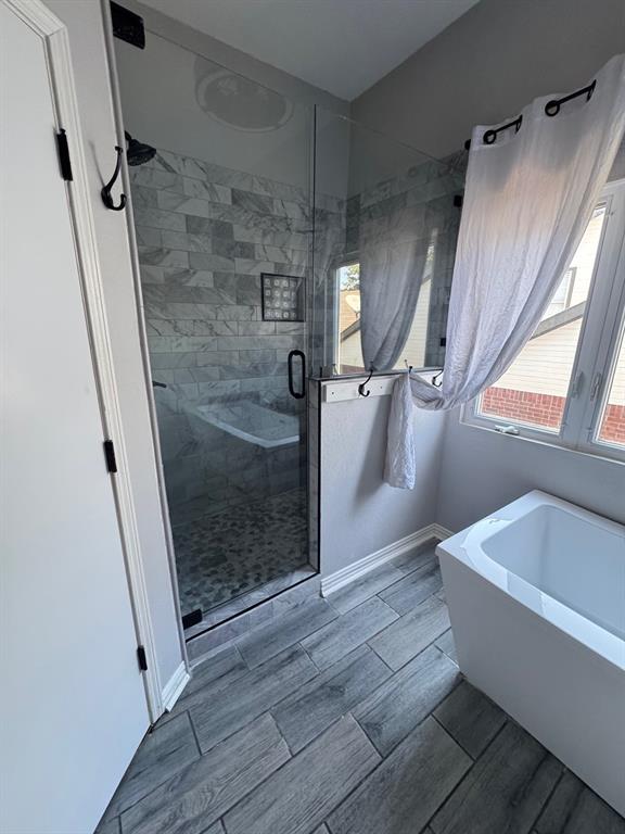 10025 Long Rifle Drive Fort Worth, TX 76108 - Photo 16 of 28 a bathroom with a bathtub and shower