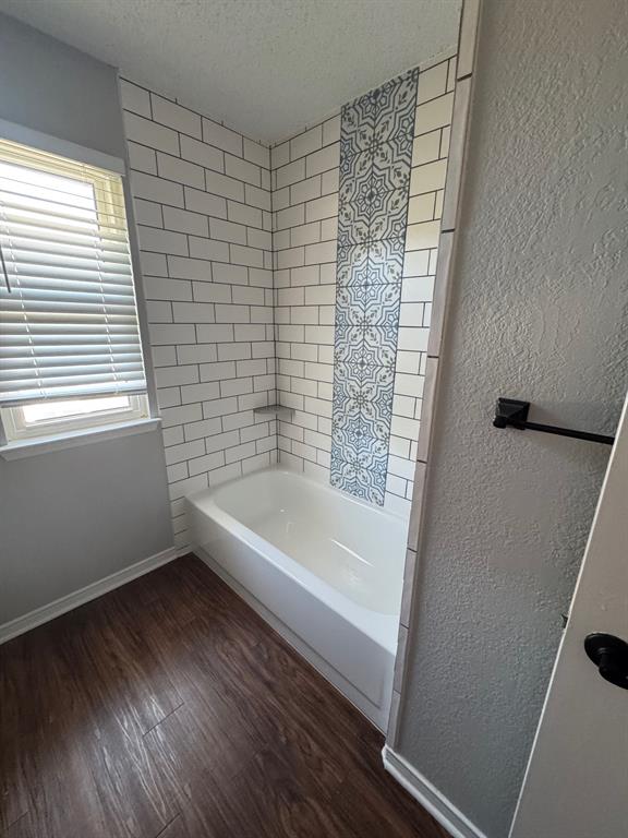 10025 Long Rifle Drive Fort Worth, TX 76108 - Photo 20 of 28 a bathroom with a bathtub and a shower
