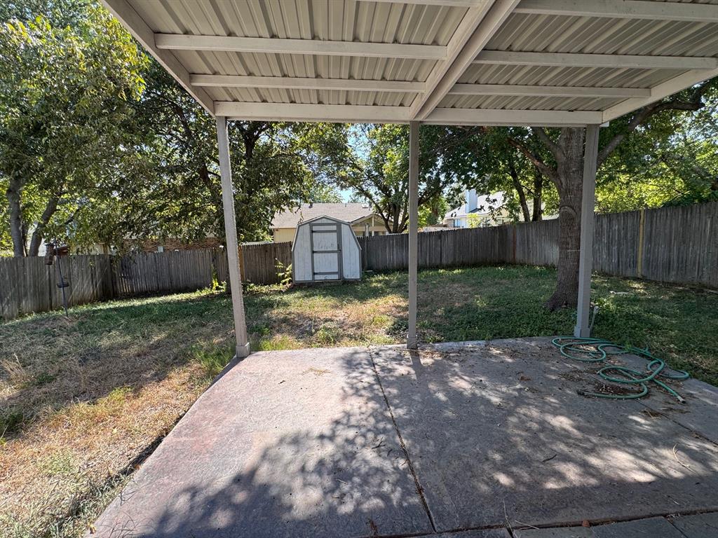 10025 Long Rifle Drive Fort Worth, TX 76108 - Photo 28 of 28 a view of a backyard with a small cabin