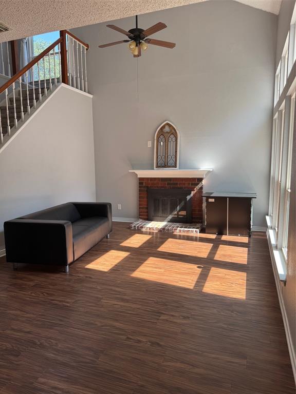 10025 Long Rifle Drive Fort Worth, TX 76108 - Photo 7 of 28 a living room with a fireplace furniture and a wooden floor