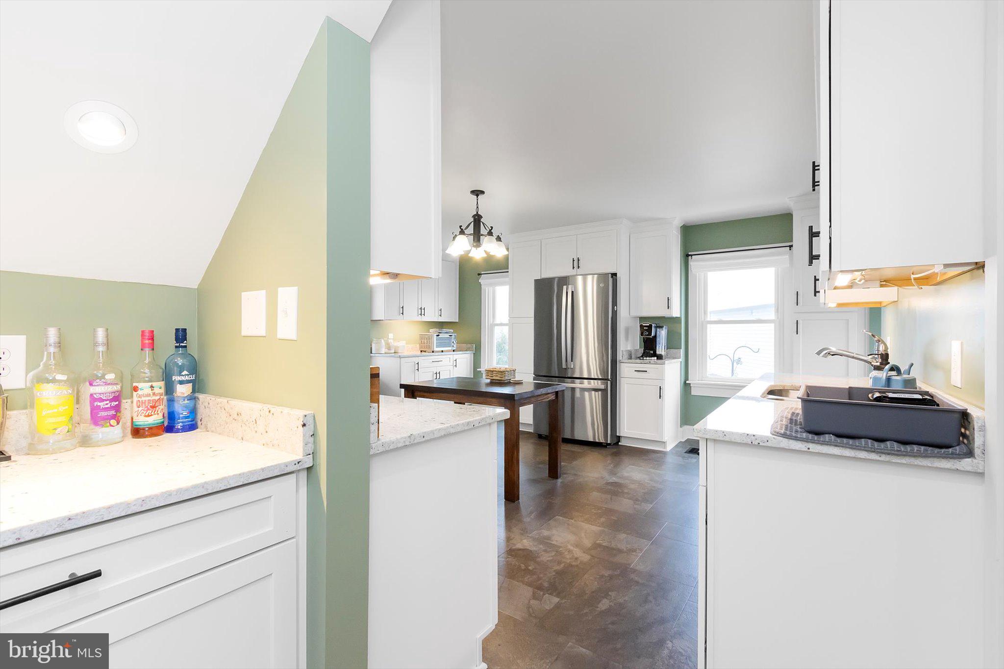 11853 White Hall Road Smithsburg, MD 21783 - Photo 11 of 40 a kitchen with stainless steel appliances kitchen island sink refrigerator and stove