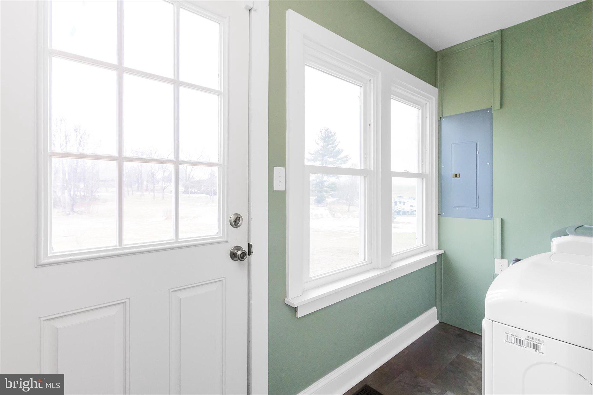 11853 White Hall Road Smithsburg, MD 21783 - Photo 15 of 40 a utility room with dryer and next to a window