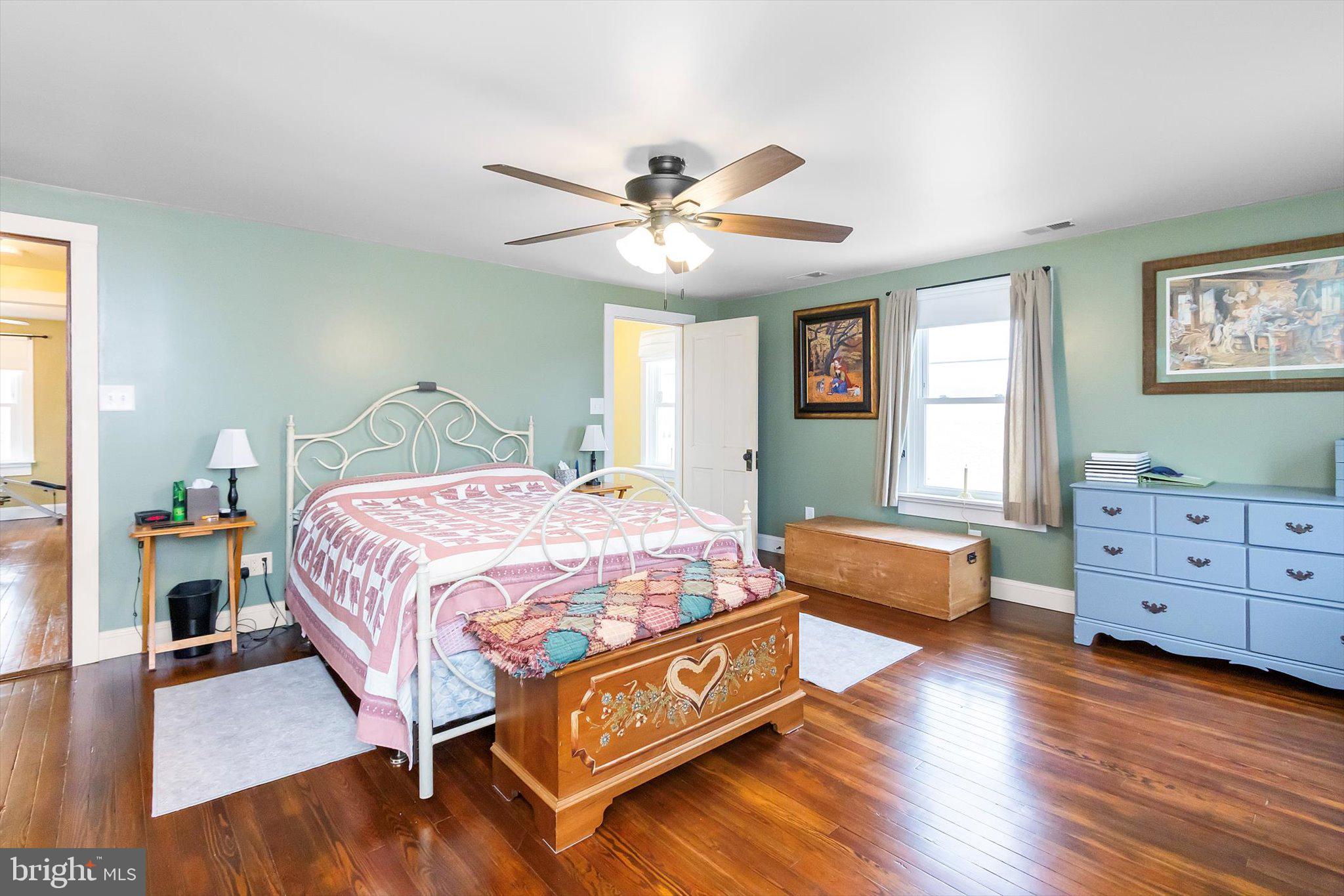 11853 White Hall Road Smithsburg, MD 21783 - Photo 17 of 40 a bedroom with a bed and wooden floor