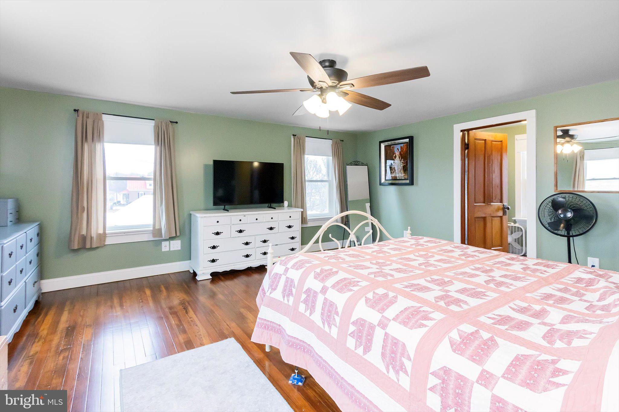 11853 White Hall Road Smithsburg, MD 21783 - Photo 18 of 40 a bedroom with a bed and a flat screen tv