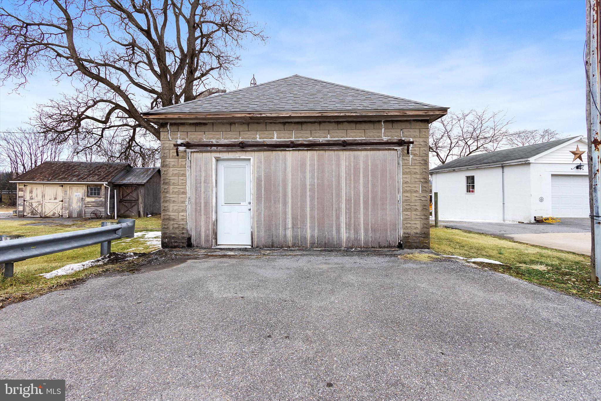 11853 White Hall Road Smithsburg, MD 21783 - Photo 38 of 40 a view of a house with a patio and a yard