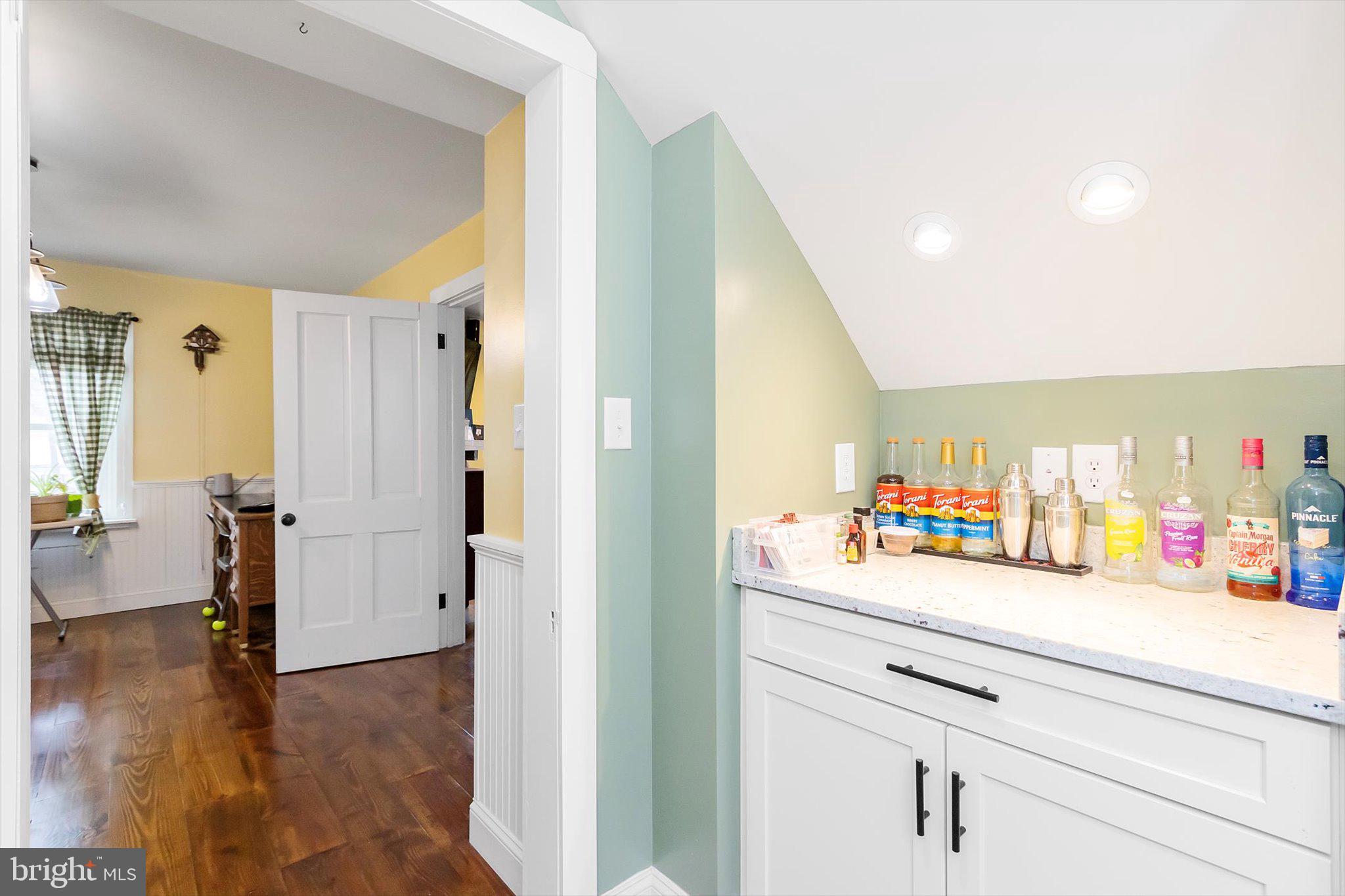 11853 White Hall Road Smithsburg, MD 21783 - Photo 10 of 40 a hallway with mirror and a wooden floor