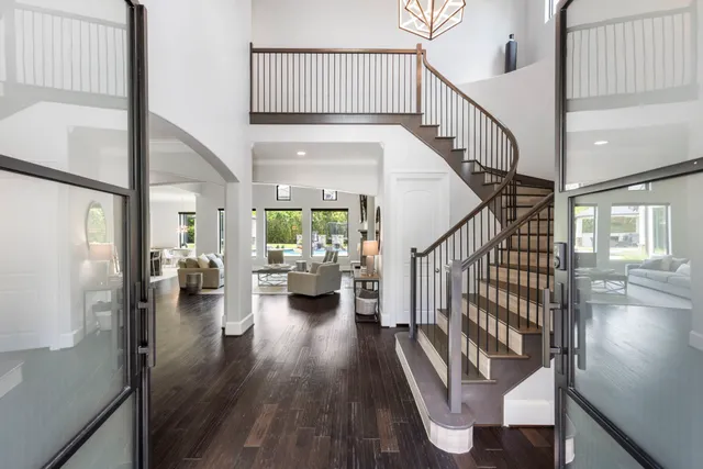 a view of entryway and hall with wooden floor