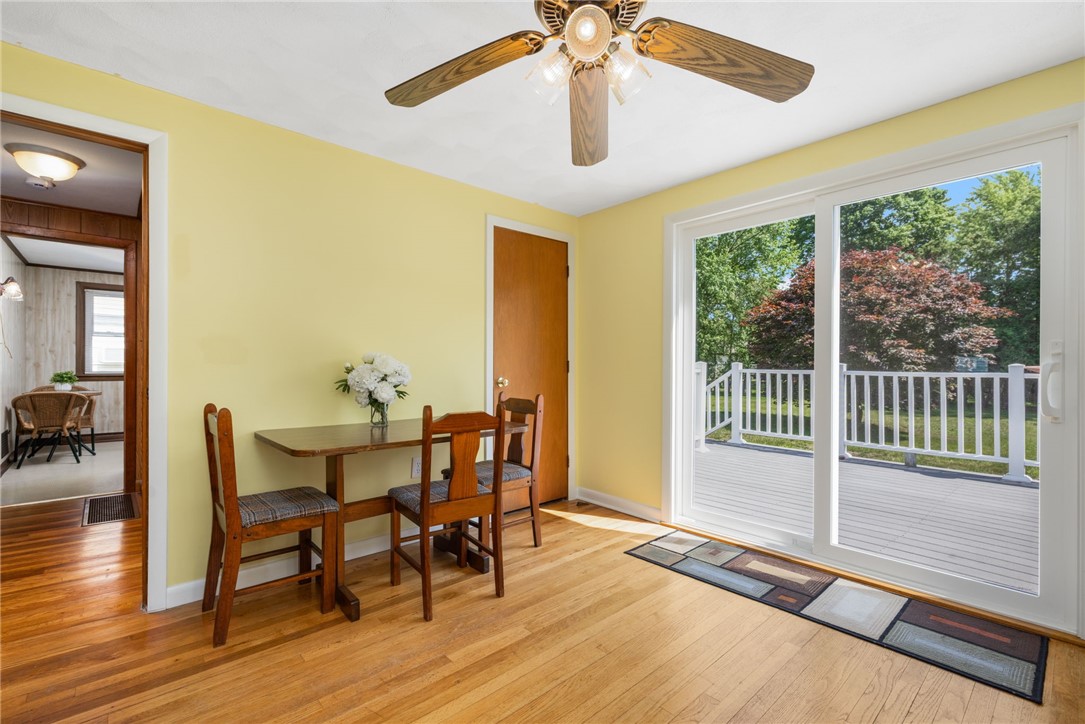 70 New Lexington Road North Kingstown, RI 02852 - Photo 9 of 30 Den/dining room with glass slider to the back deck and yard