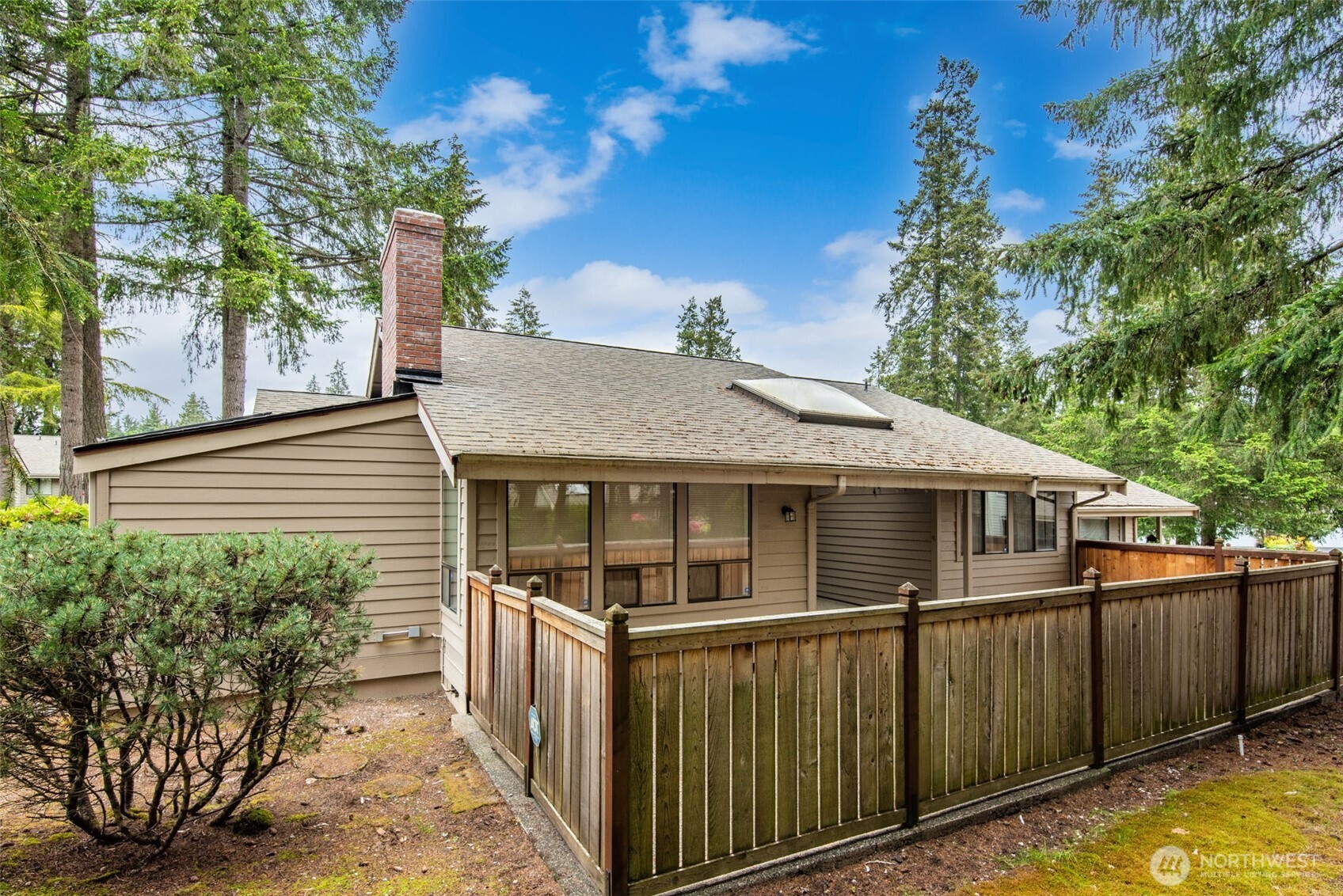 1322 Boise Street Fircrest, WA 98466 - Photo 38 of 40 a view of a house with wooden fence