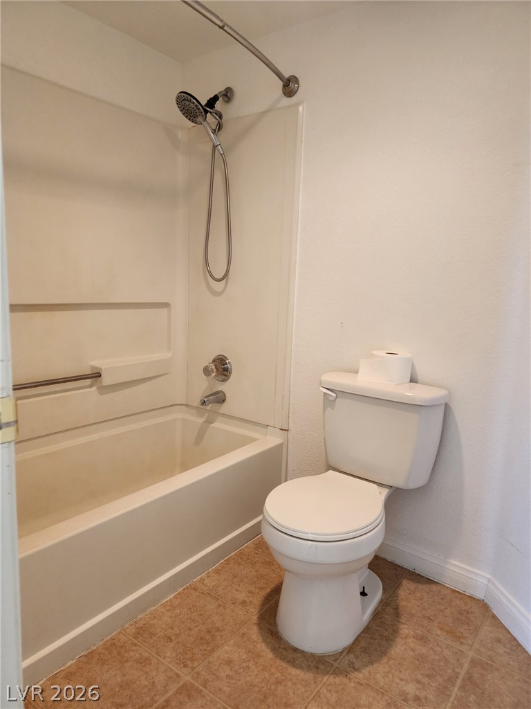 231 West Horizon Ridge Parkway, Unit 1127 Henderson, NV 89012 - Photo 33 of 39 Functional full bathroom featuring a tub-shower combination and tiled flooring.