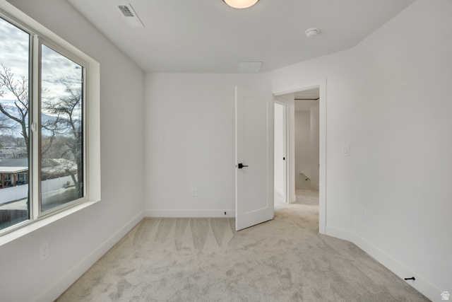 330 East 7635 S Street Sandy, UT 84047 - Photo 18 of 29 Spare room featuring light carpet and baseboards