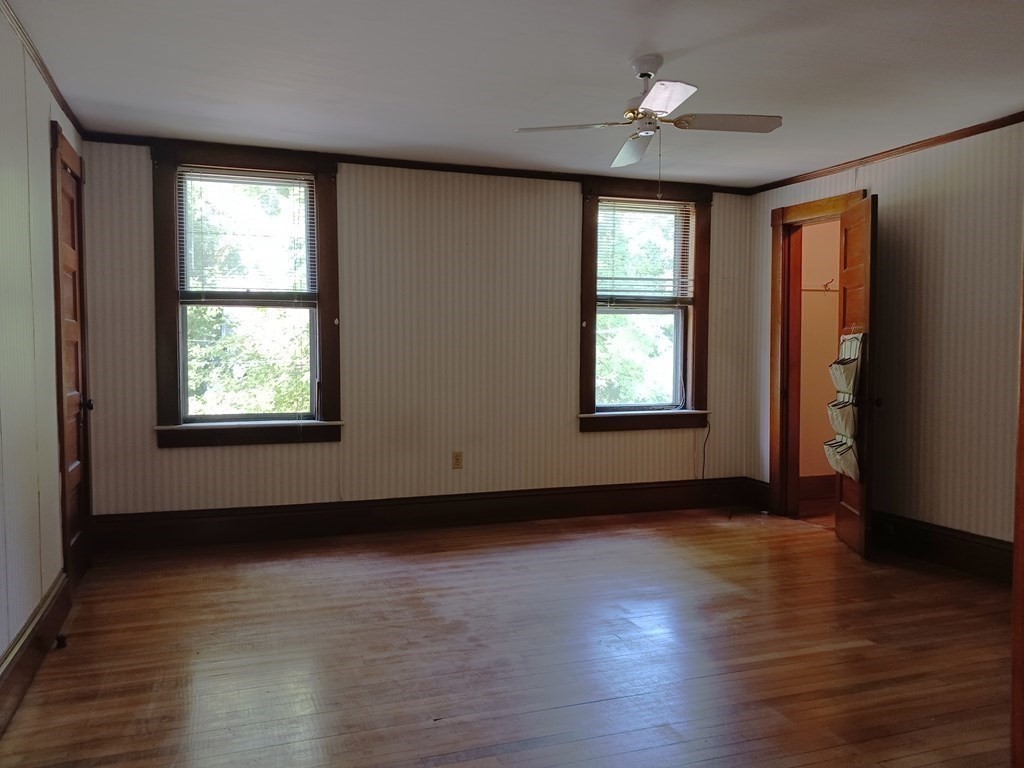 31 Orange Street Athol, MA 01331 - Photo 17 of 29 an empty room with wooden floor and windows