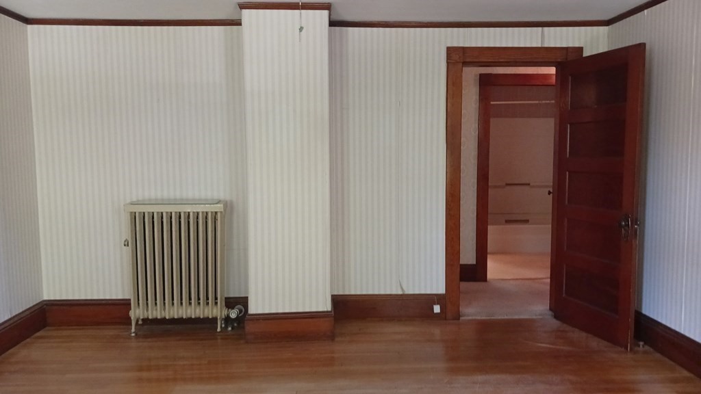 31 Orange Street Athol, MA 01331 - Photo 18 of 29 an empty room with wooden floor and windows