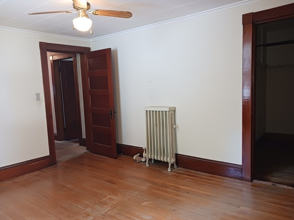 31 Orange Street Athol, MA 01331 - Photo 22 of 29 an empty room with wooden floor and closet