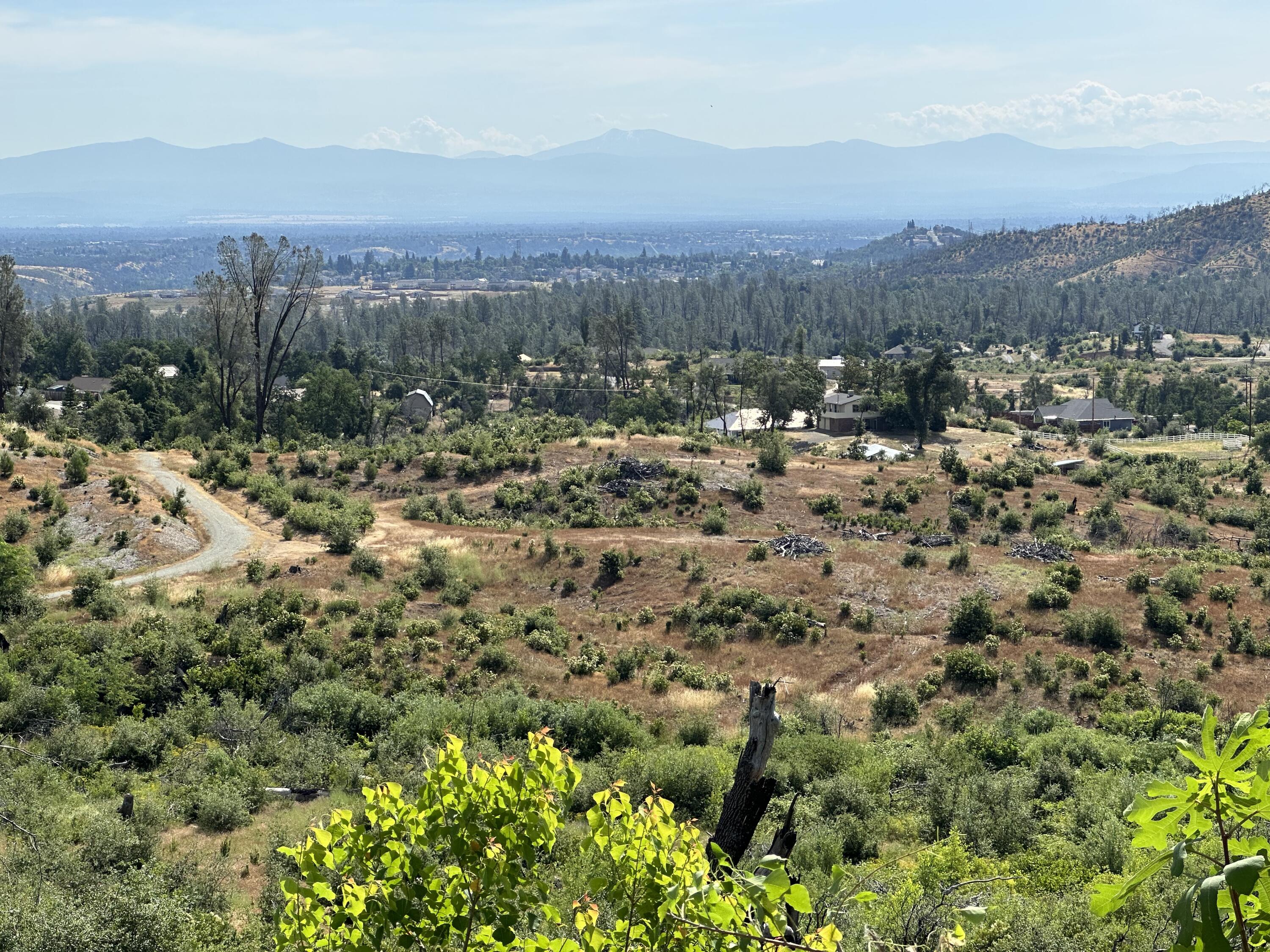 15691 Old Stage Coach Road Redding, CA 96001 - Photo 3 of 27 a view of a city with mountains in the background