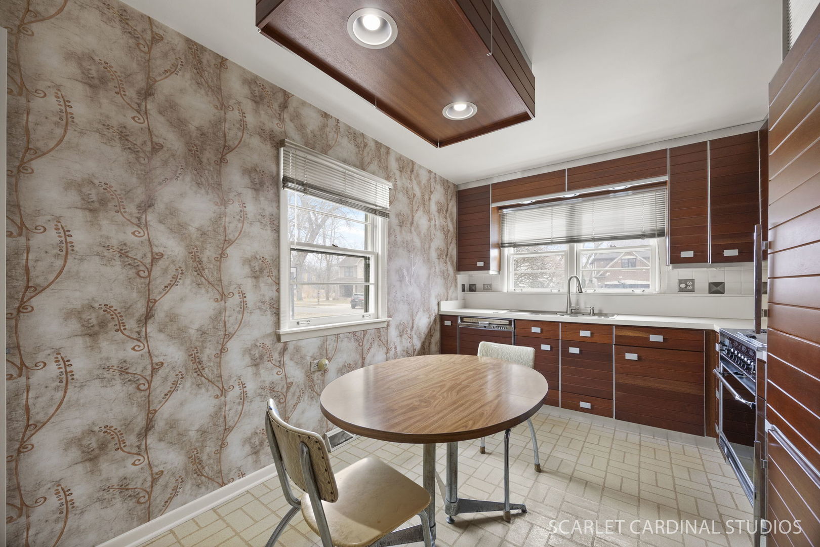 110 Travers Avenue Wheaton, IL 60187 - Photo 5 of 15 a kitchen with a sink cabinets and window