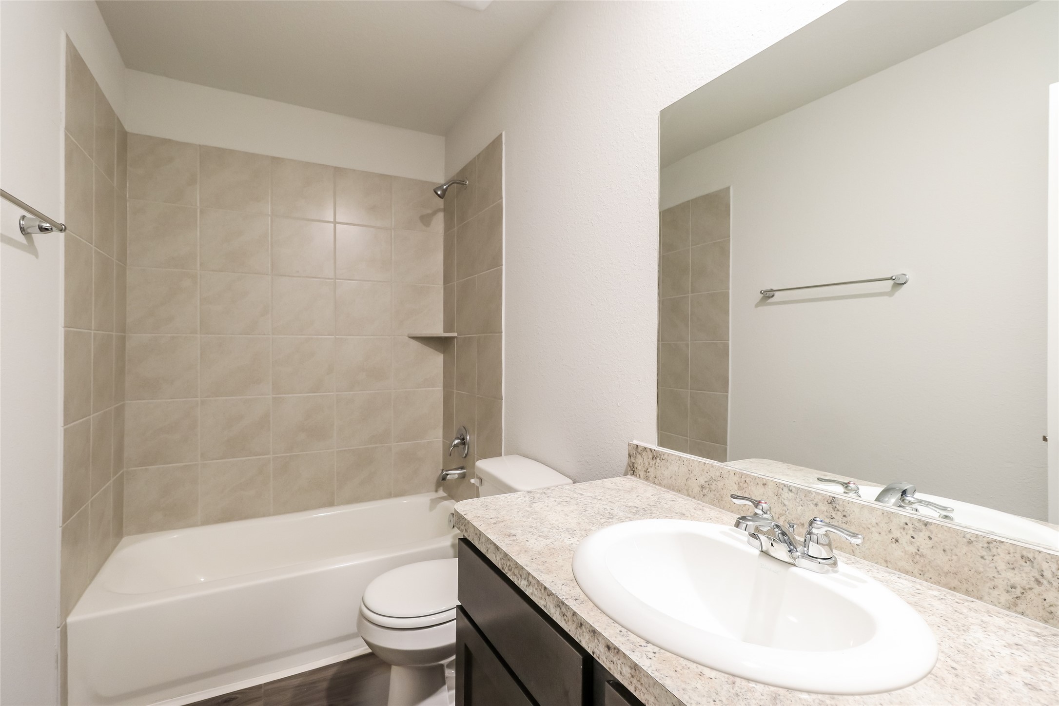 2515 Westslope Drive Conroe, TX 77384 - Photo 14 of 20 a bathroom with a sink a toilet and a mirror