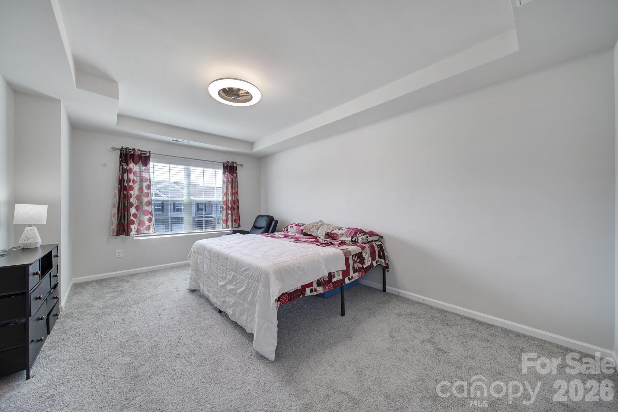 8042 Scarlet Maple Lane Fort Mill, SC 29708 - Photo 16 of 37 a bedroom with a bed and a window
