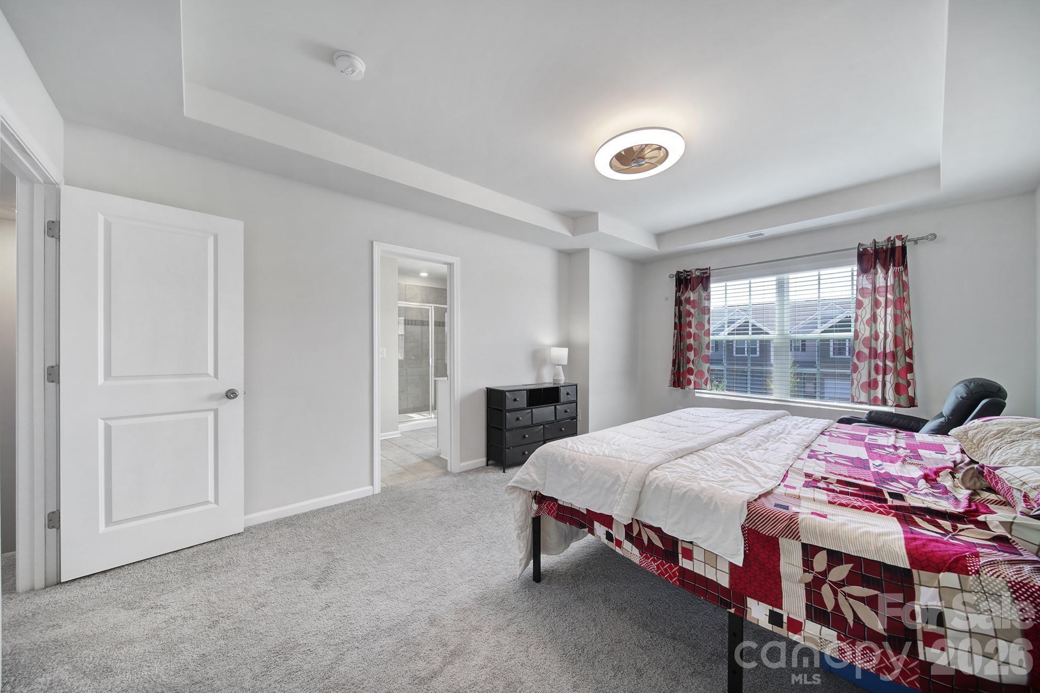 8042 Scarlet Maple Lane Fort Mill, SC 29708 - Photo 18 of 37 a bedroom with a bed and a window