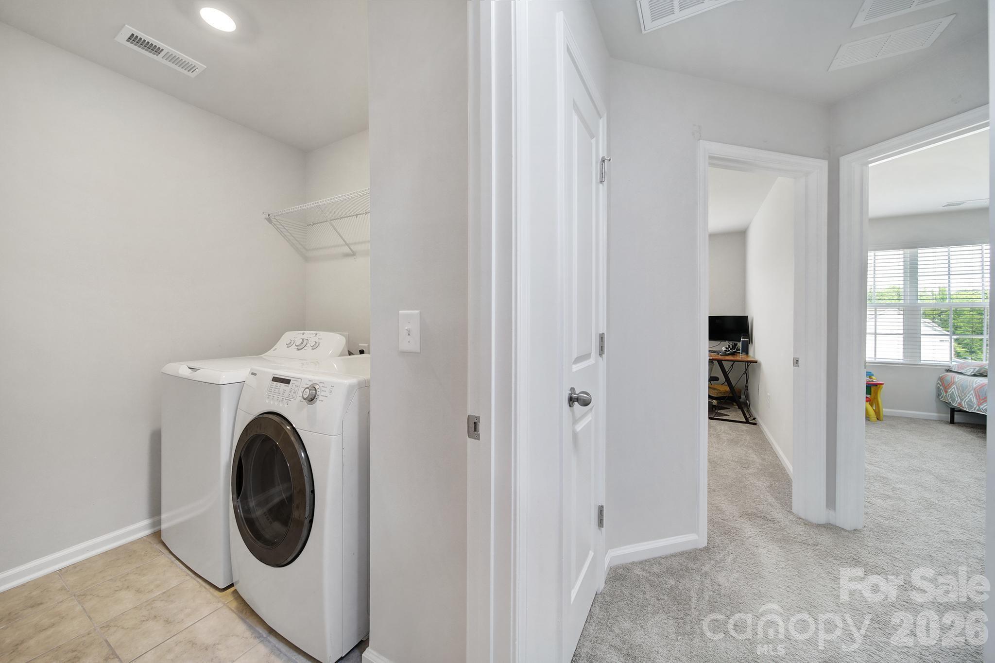 8042 Scarlet Maple Lane Fort Mill, SC 29708 - Photo 21 of 37 a view of a storage & utility room with washer and dryer