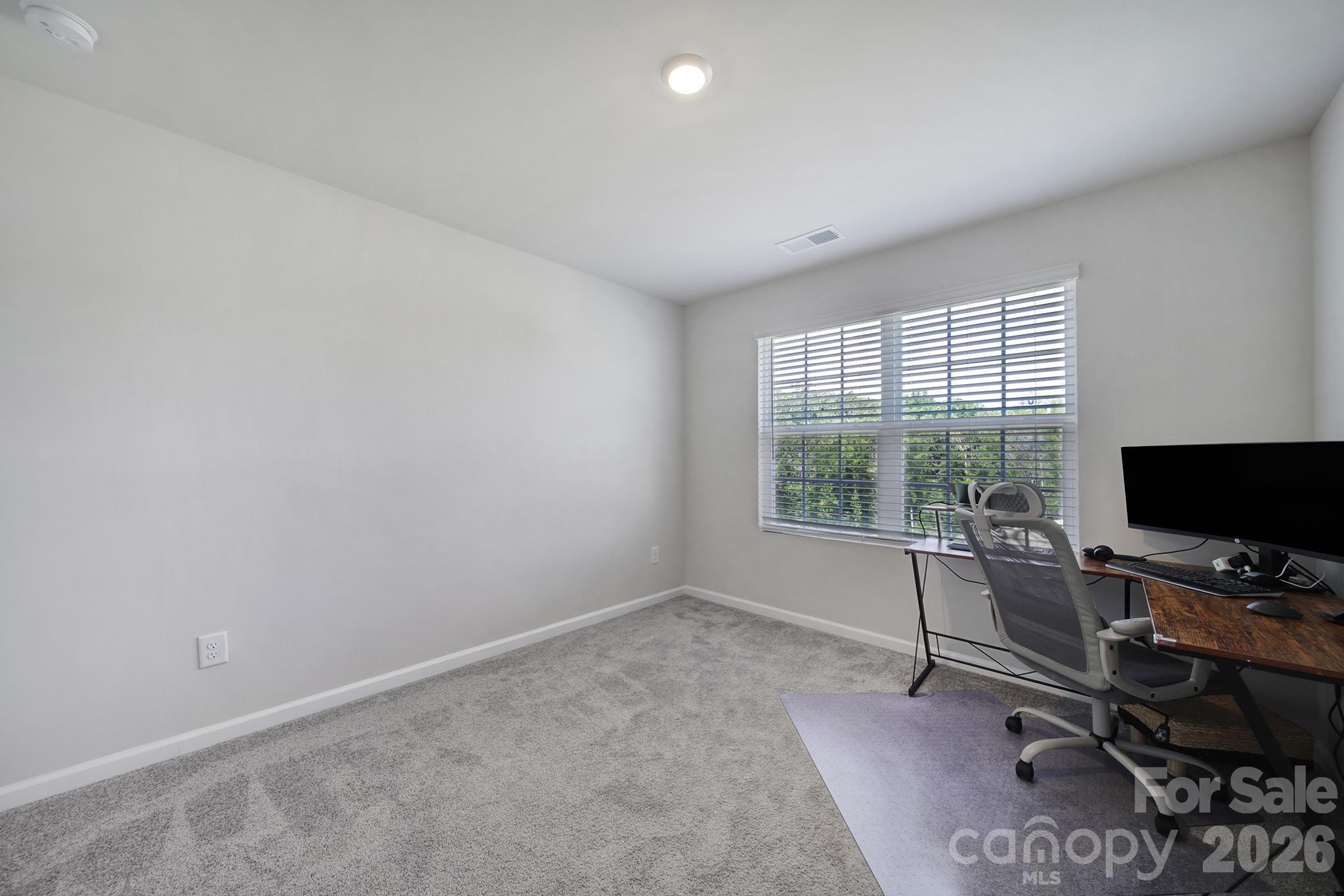 8042 Scarlet Maple Lane Fort Mill, SC 29708 - Photo 25 of 37 a view of a workspace with furniture and a window