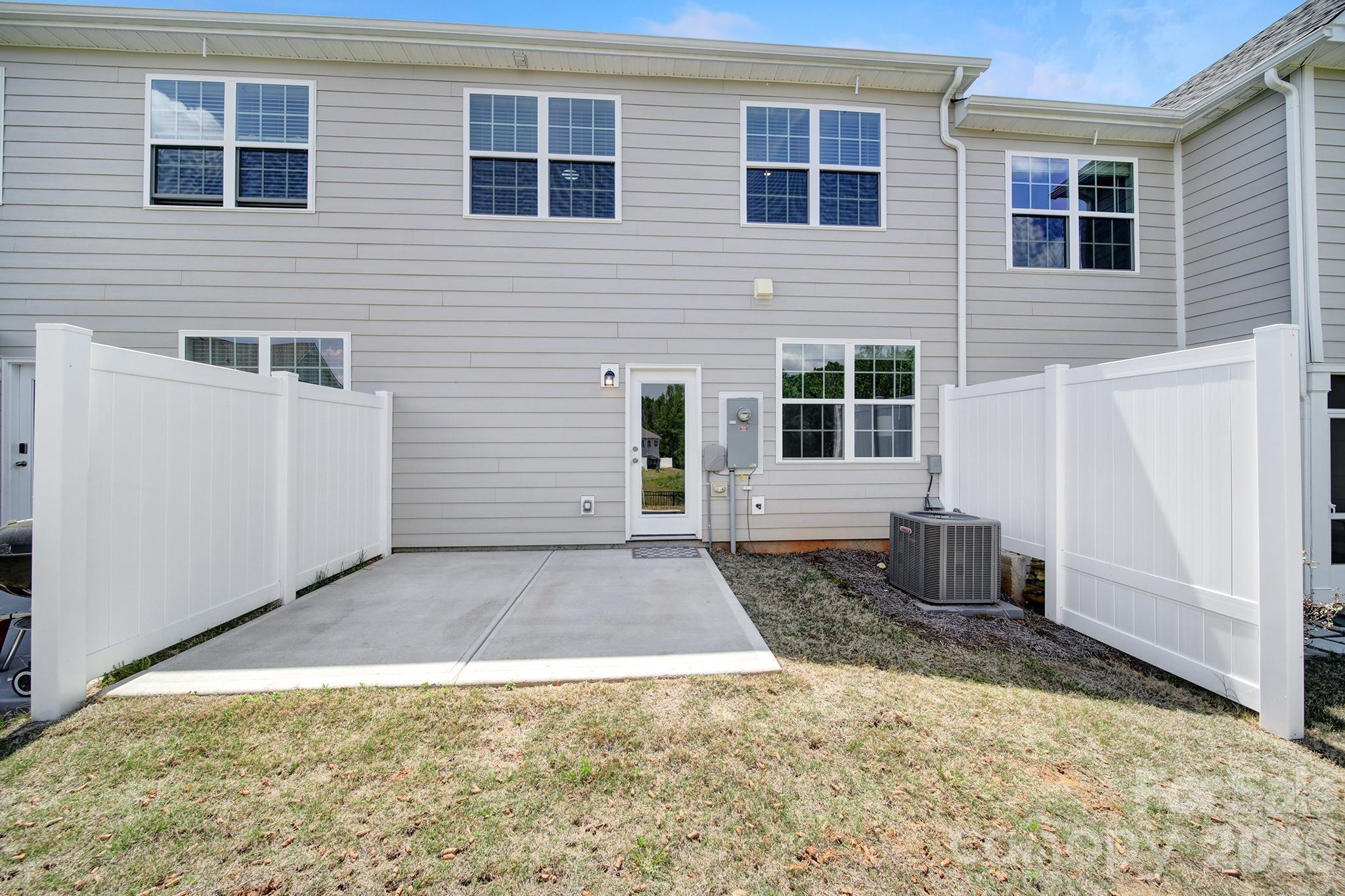 8042 Scarlet Maple Lane Fort Mill, SC 29708 - Photo 27 of 37 a front view of a house with glass windows