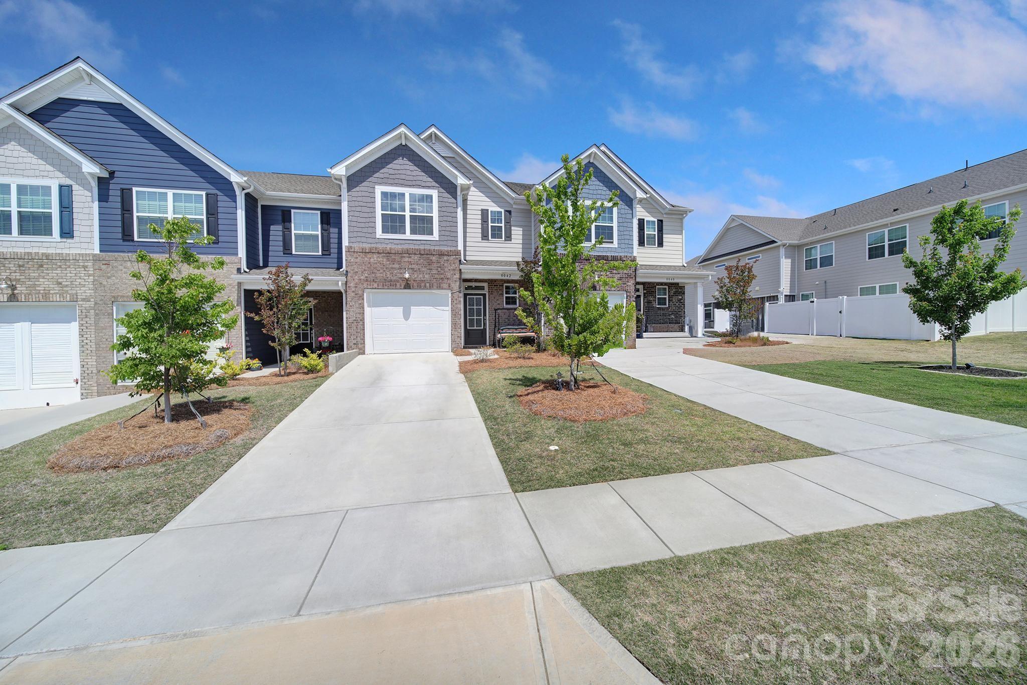 8042 Scarlet Maple Lane Fort Mill, SC 29708 - Photo 37 of 37 a front view of a house with a yard and garage
