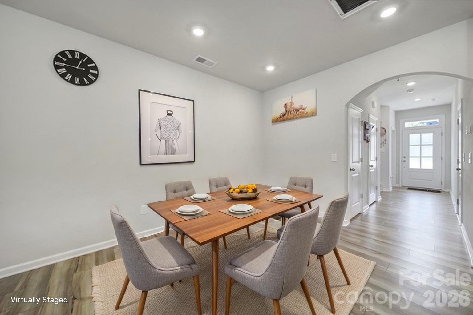 8042 Scarlet Maple Lane Fort Mill, SC 29708 - Photo 10 of 37 a view of a dining room with furniture and wooden floor