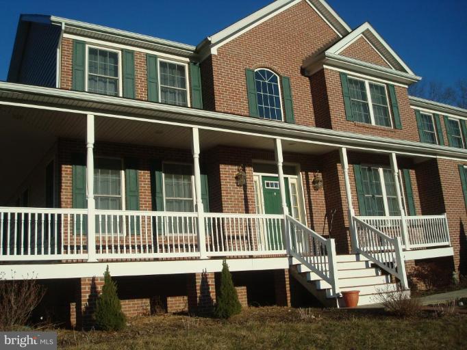 20115 Gunpowder Road Manchester, MD 21102 - Photo 1 of 29 a view of a house with a small deck