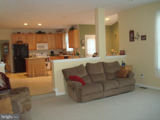 20115 Gunpowder Road Manchester, MD 21102 - Photo 2 of 29 a living room with furniture and kitchen view