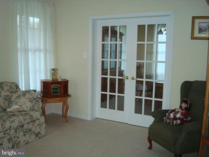 20115 Gunpowder Road Manchester, MD 21102 - Photo 13 of 29 a living room with furniture potted plant and a window