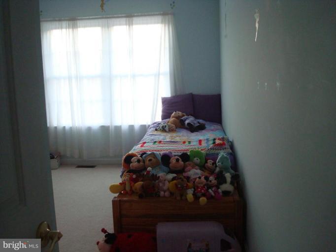 20115 Gunpowder Road Manchester, MD 21102 - Photo 16 of 29 a bed sitting in a bedroom next to a window