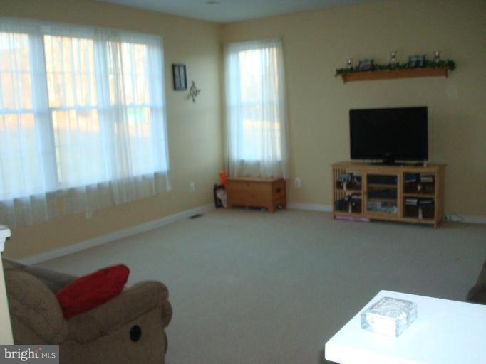 20115 Gunpowder Road Manchester, MD 21102 - Photo 3 of 29 a living room with furniture and a flat screen tv