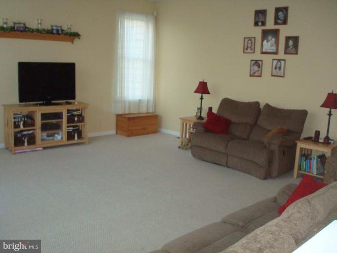 20115 Gunpowder Road Manchester, MD 21102 - Photo 21 of 29 a living room with furniture and a flat screen tv