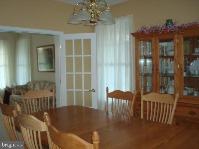 20115 Gunpowder Road Manchester, MD 21102 - Photo 7 of 29 a view of a dining room with furniture and chandelier