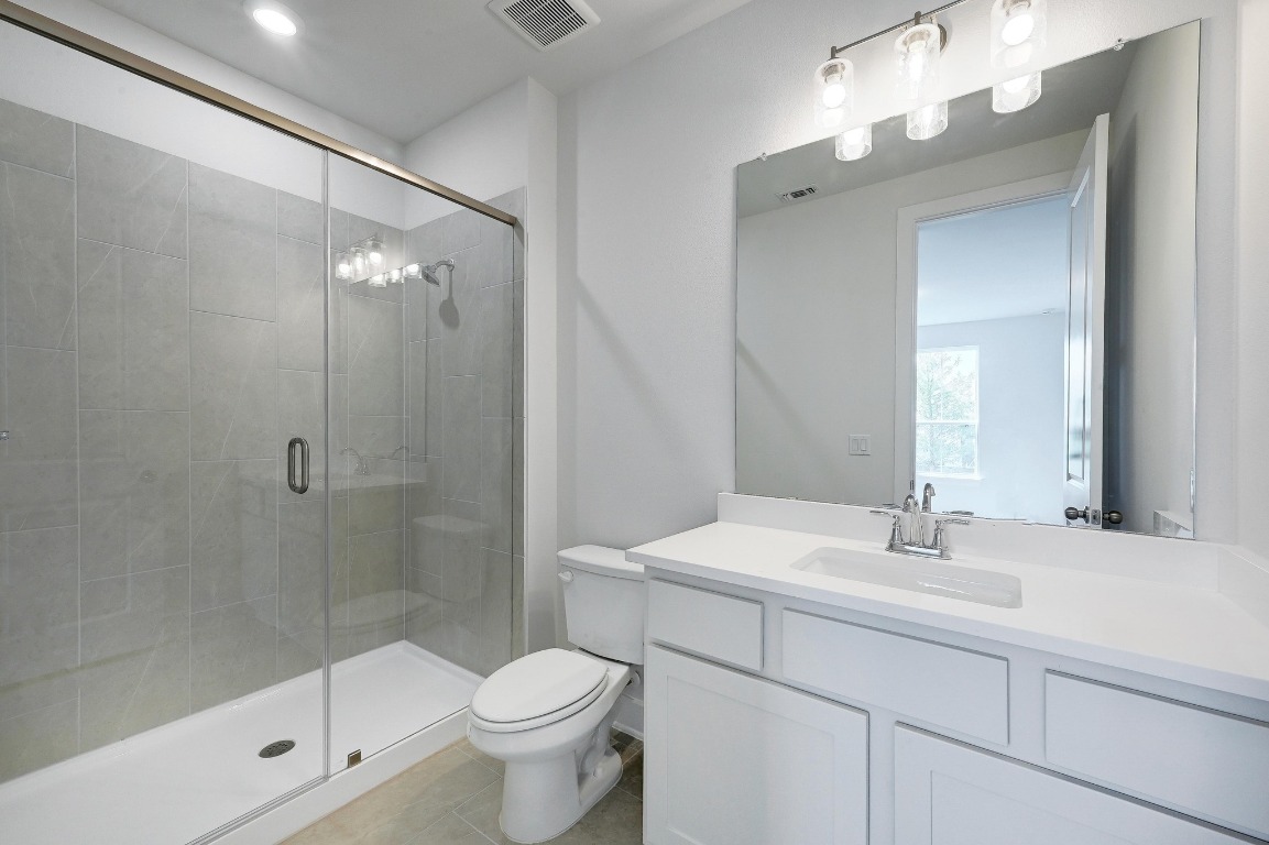 256 Star Rush Trail Georgetown, TX 78633 - Photo 13 of 23 a bathroom with a sink a toilet and shower