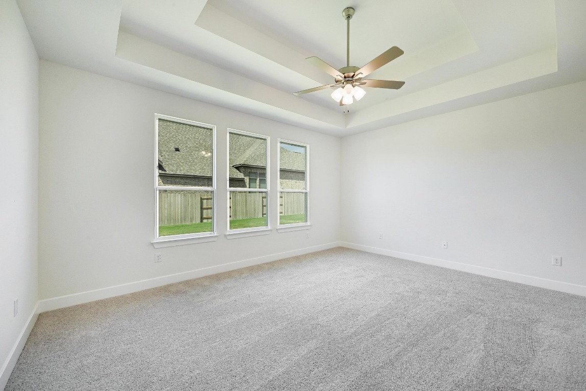256 Star Rush Trail Georgetown, TX 78633 - Photo 7 of 23 an empty room with windows and fan