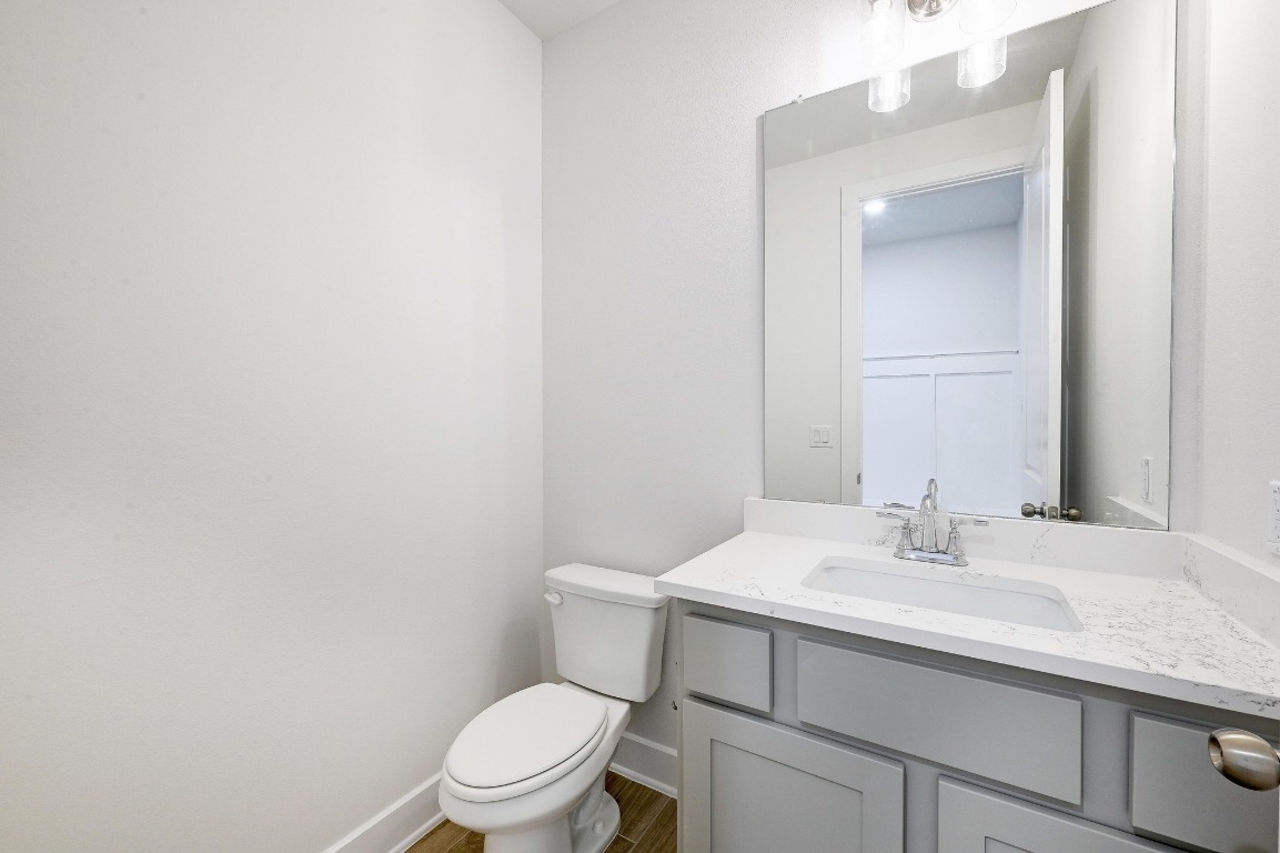 256 Star Rush Trail Georgetown, TX 78633 - Photo 10 of 23 a bathroom with a sink toilet and vanity