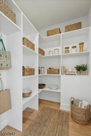 a view of staircase with white walls and windows