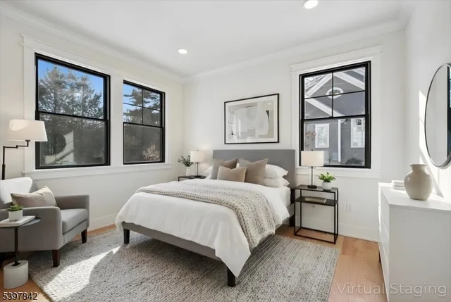 a spacious bedroom with a large bed and a couch