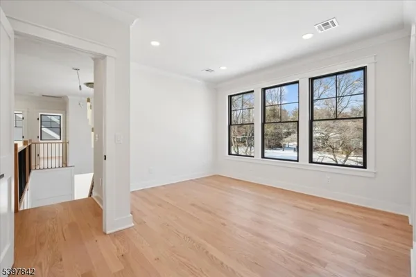 a view of empty room with a fireplace