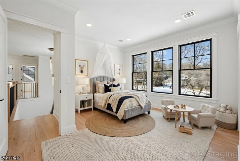 32 Felch Road Florham Park, NJ 07932 - Photo 25 of 45 a bedroom with a bed and wooden floor