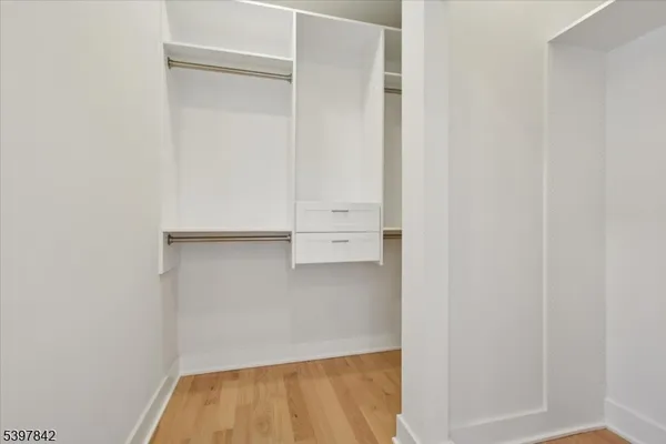 an empty room with wooden floor