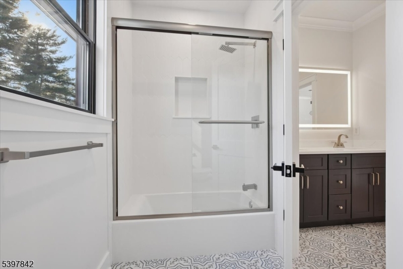 32 Felch Road Florham Park, NJ 07932 - Photo 30 of 45 a bathroom with a shower sink and mirror