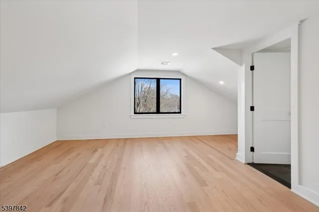 an empty room with wooden floor