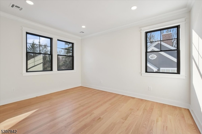 32 Felch Road Florham Park, NJ 07932 - Photo 35 of 45 a view of an empty room with a window and wooden floor