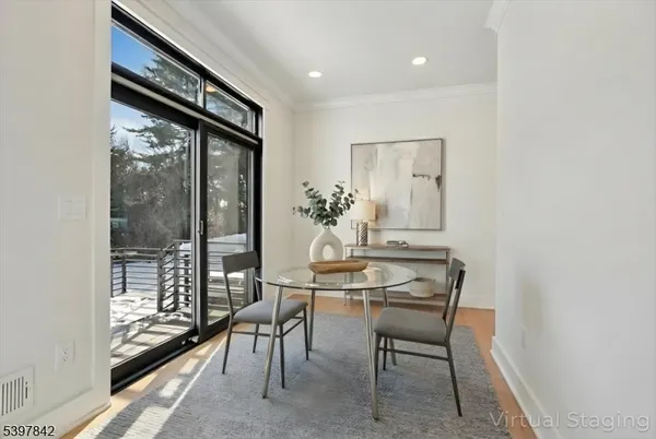 a view of staircase with white walls and windows